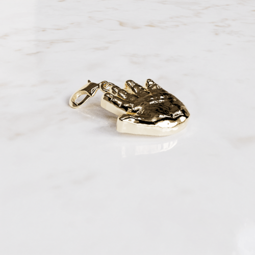 handafdruk bedeltje in het goud